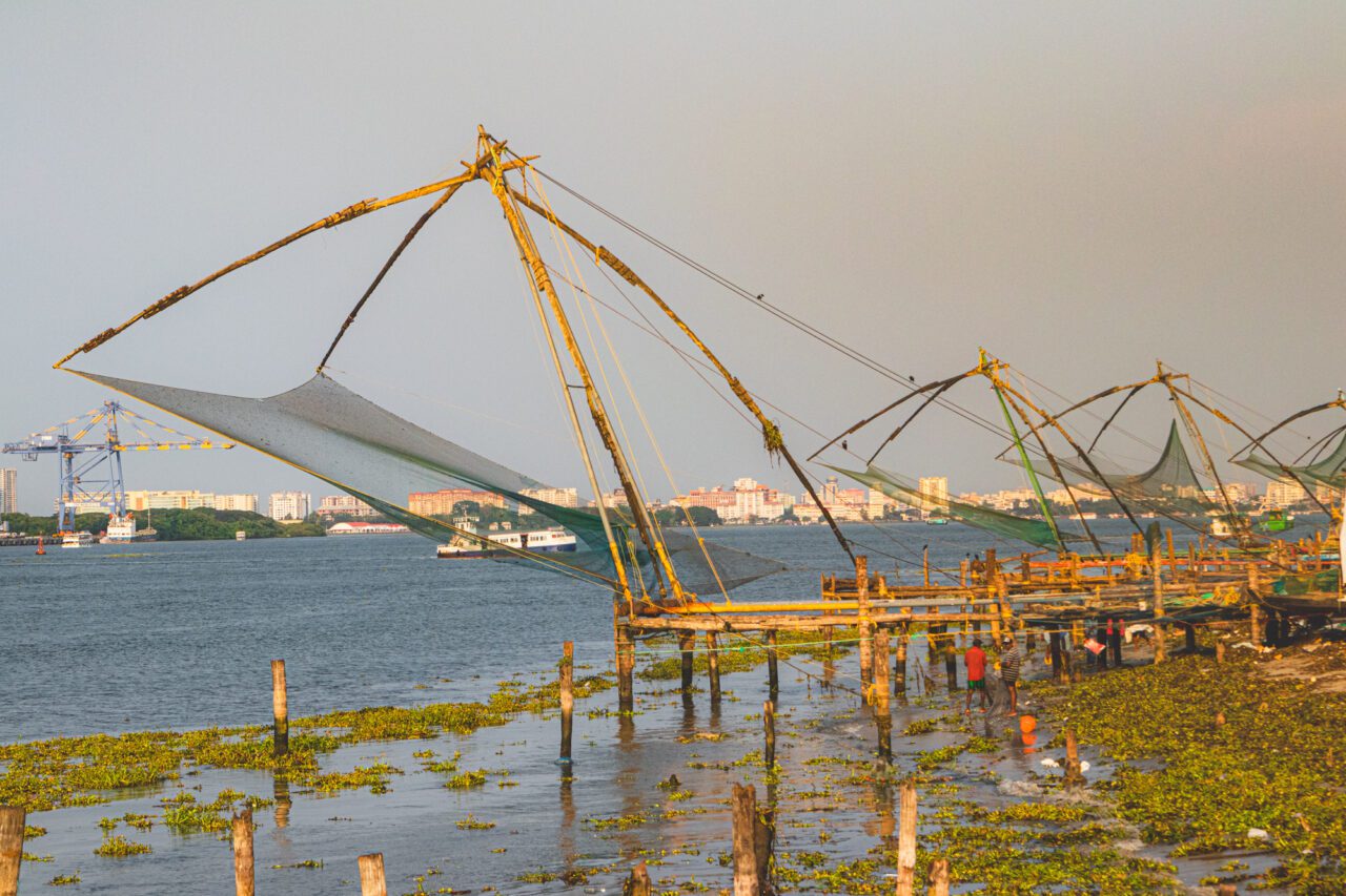 Chinese fishing nets in the golden light of sunset - the symbol of Kochi and its maritime soul