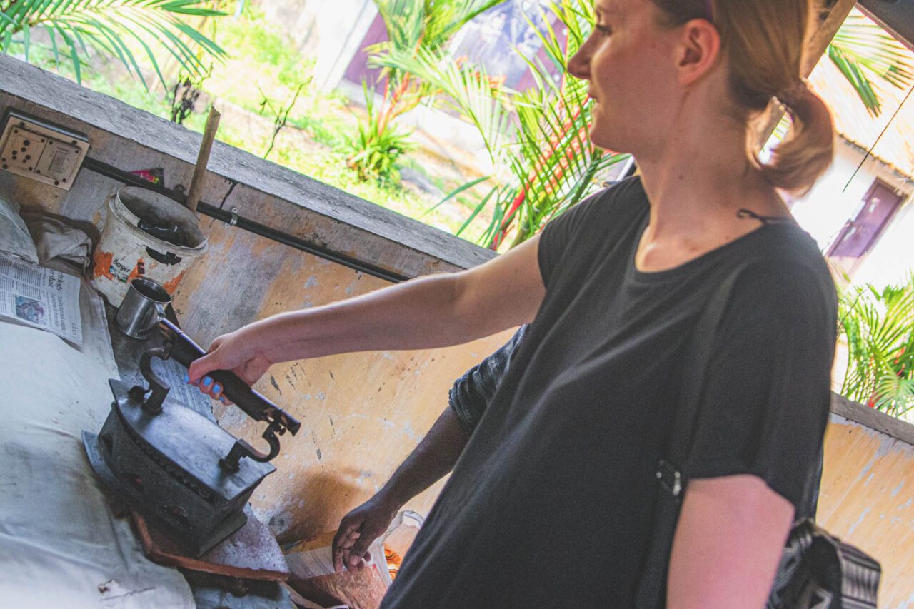 Trying to iron at Dhobi Khana - a heavy coal iron and a good dose of humility in the face of tradition