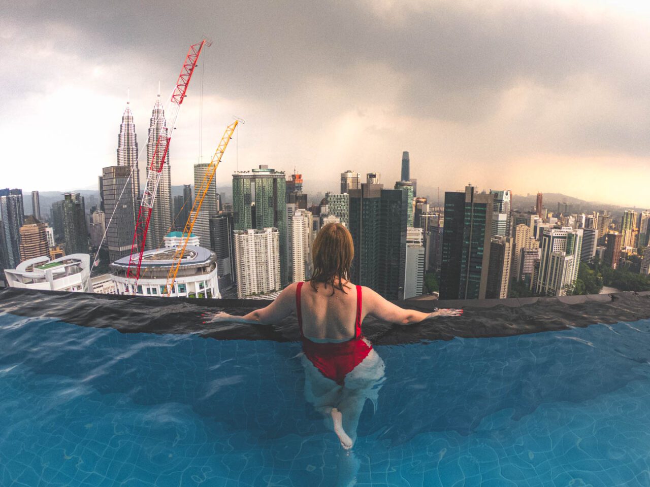 Infinity pool on the roof of KL Platinum Suite 42 By SNC with a view of Kuala Lumpur's panorama