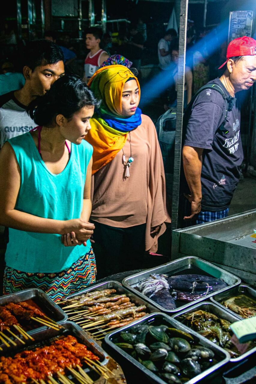 The evening line at the Gili Trawangan night market - choosing fresh fish, seafood and skewers is a little pre-dinner ritual everyone loves.