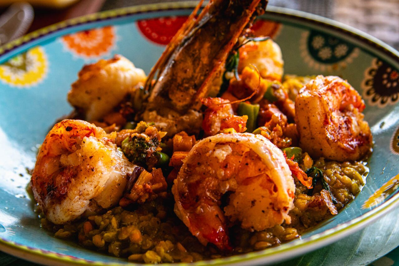 Shrimp at Pearl Beach Lounge - juicy, slightly spicy, served with vegetables and fragrant rice. Perfect for a beachfront dinner.