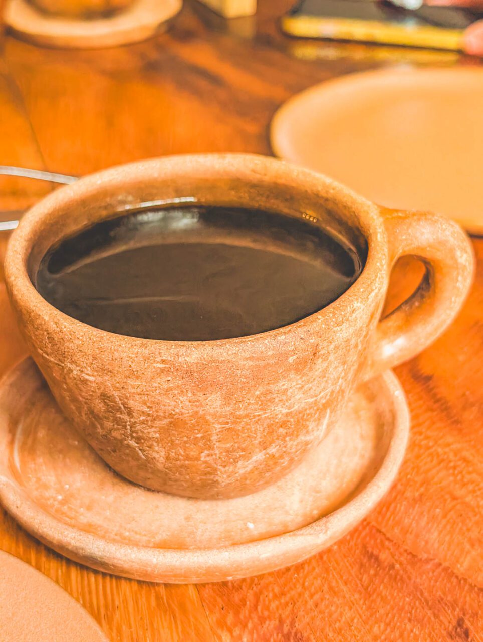 Coffee served in a clay cup at Levadura de Olla in Oaxaca.