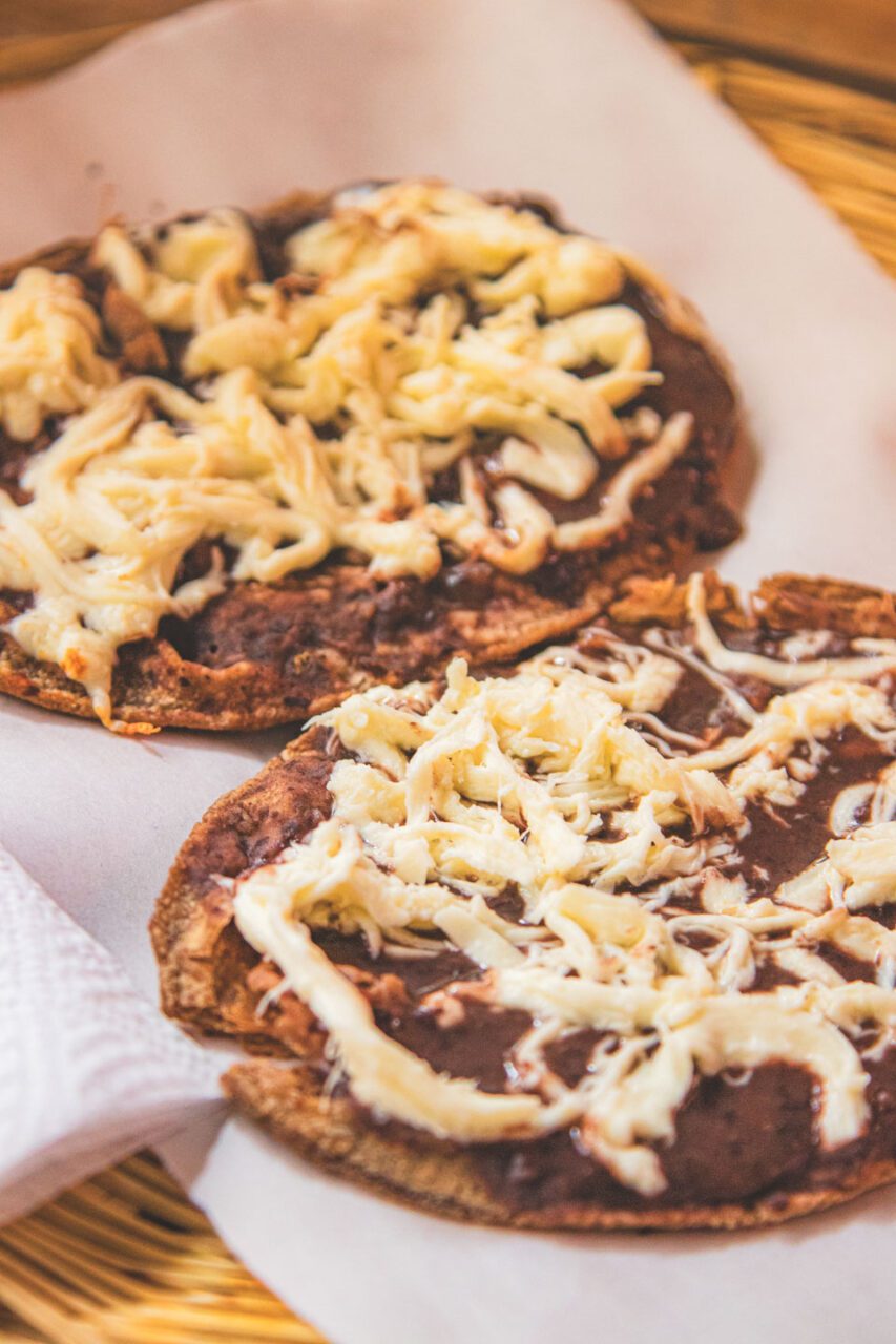 Memelas made with black corn, served with bean paste and cheese at La Cosecha Organic Market in Oaxaca.