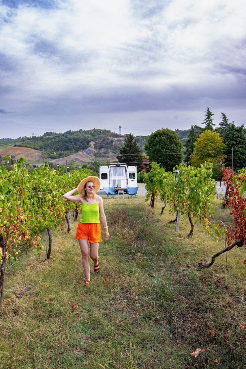 A campervan on a seaside road during a trip.