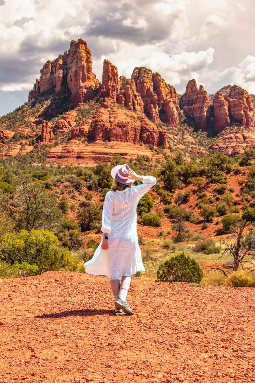woman in white dress in Sedona red rock landscape Arizona scenic view