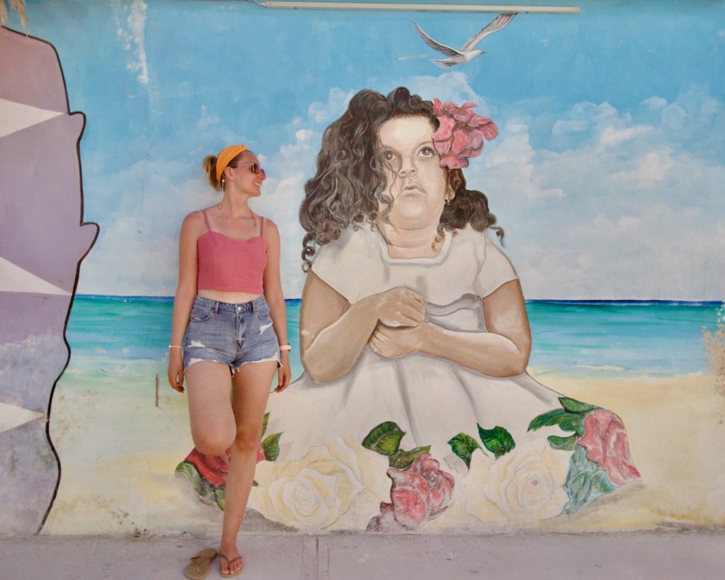 Woman and beautiful street art of Isla Holbox, Quintana Roo, Mexico