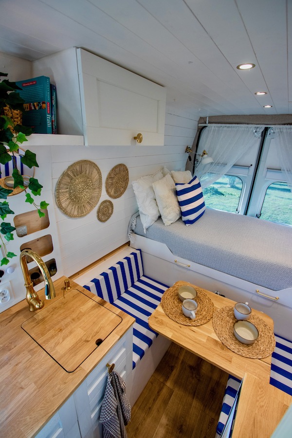 Cutting board on the sink in a camper van - an irreplaceable helper in the kitchen during vanlife