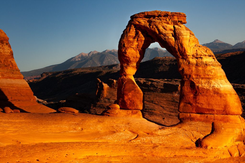 The sunset view of Delicate Arch in Arches National Park is a breathtaking natural spectacle