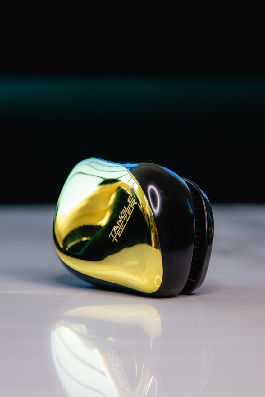 A compact hairbrush makes effortless hair styling on the go much easier