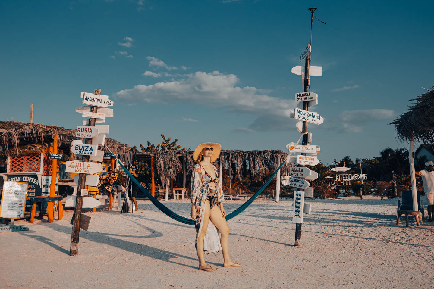 Runaway Ann on Isla Holbox beach - between direction signs and hammocks, in the rhythm of Caribbean chill.