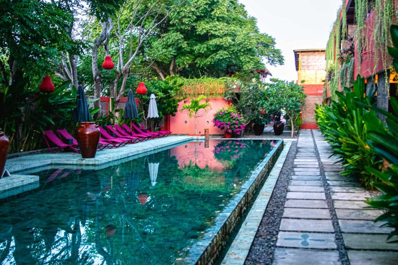 PinkCoco pool in the morning - pink loungers, lush greenery, and that quiet island calm that sets the tone for the whole day.