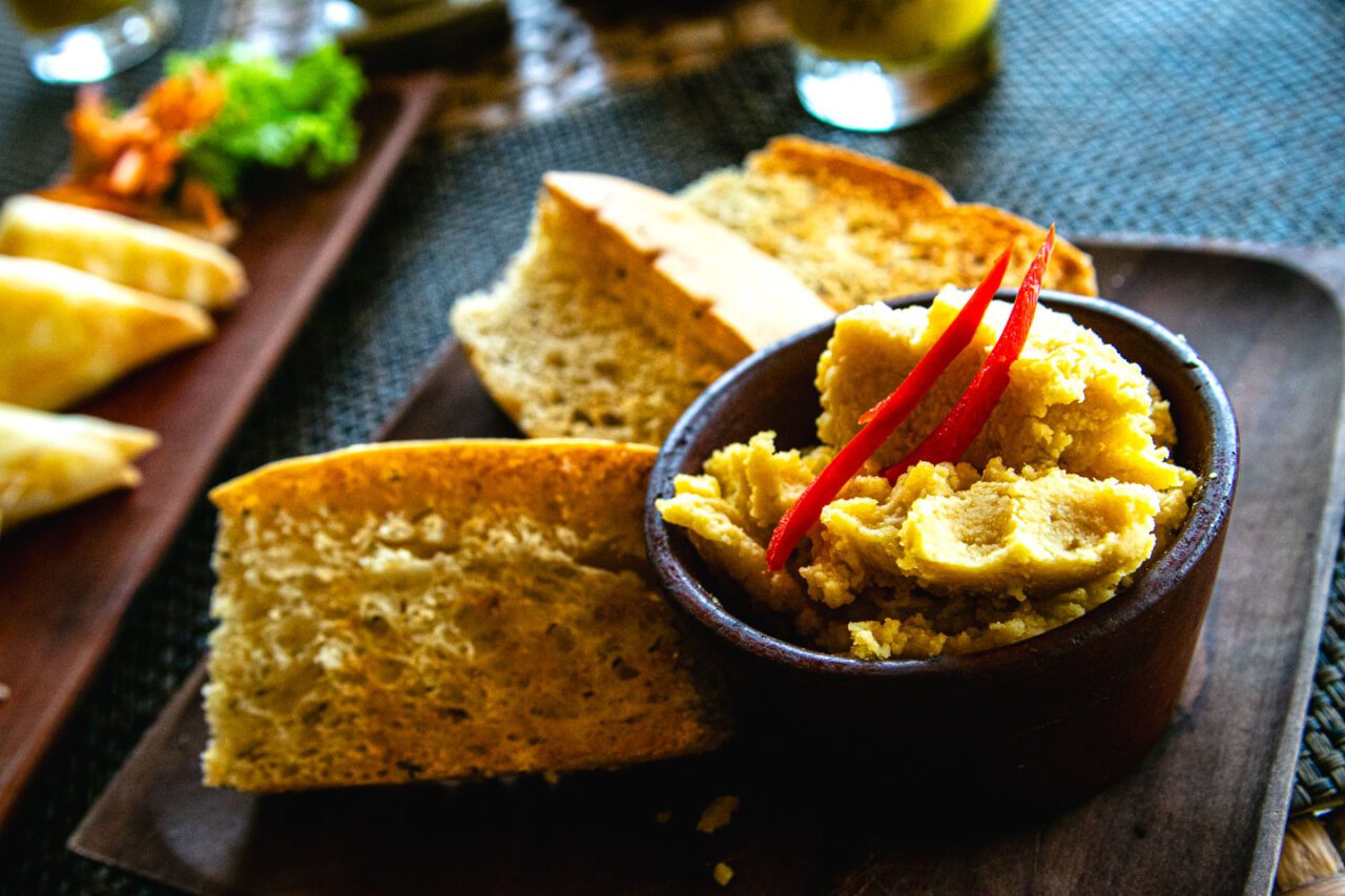 Starter at Pearl Beach Lounge - warm bread with aromatic chickpea dip and a hint of chili. Simple, fresh, and delicious.