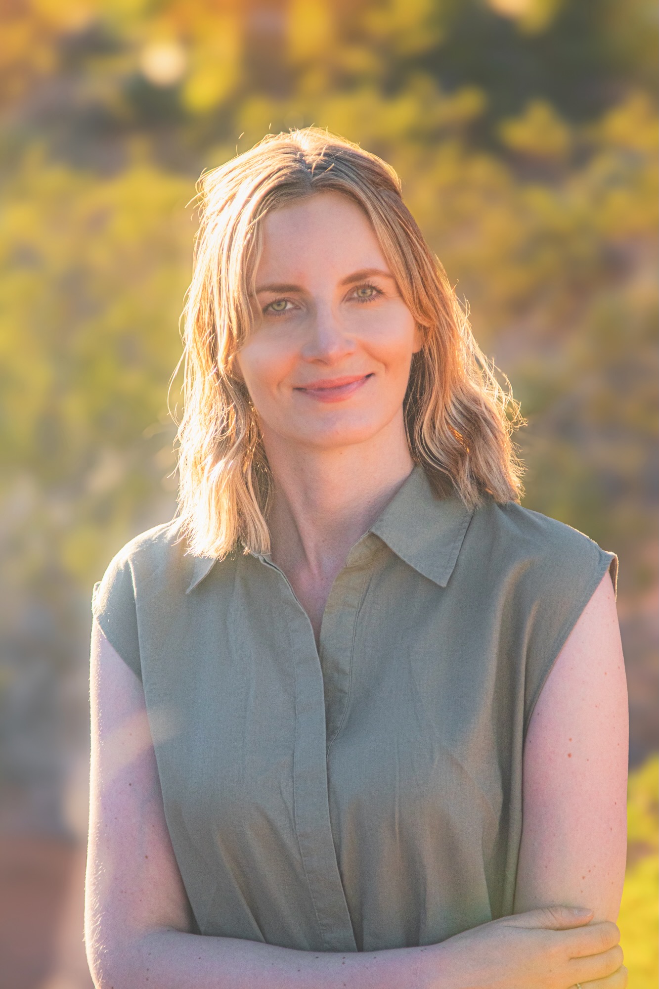 Portrait of Anna Flik, Polish travel blogger behind Runaway Ann, captured in warm desert light - soulful, natural, and serene.