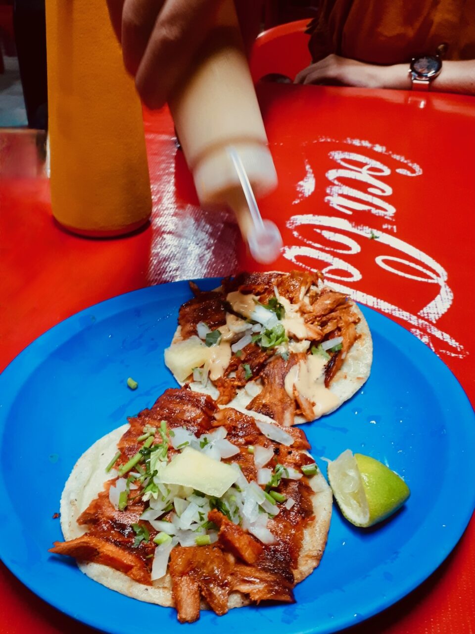 Tacos al pastor with pineapple and chipotle sauce at the iconic Taco Queto – an Isla Holbox street classic that tastes best after sunset.